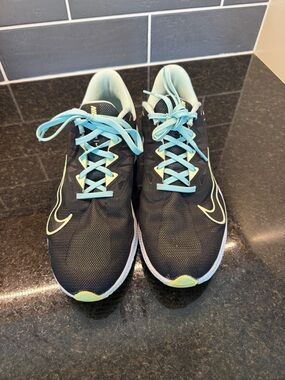 Nike Women's Black Running Shoes with Light Blue and Neon Yellow Details